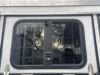 Dropdown trailer window with bars